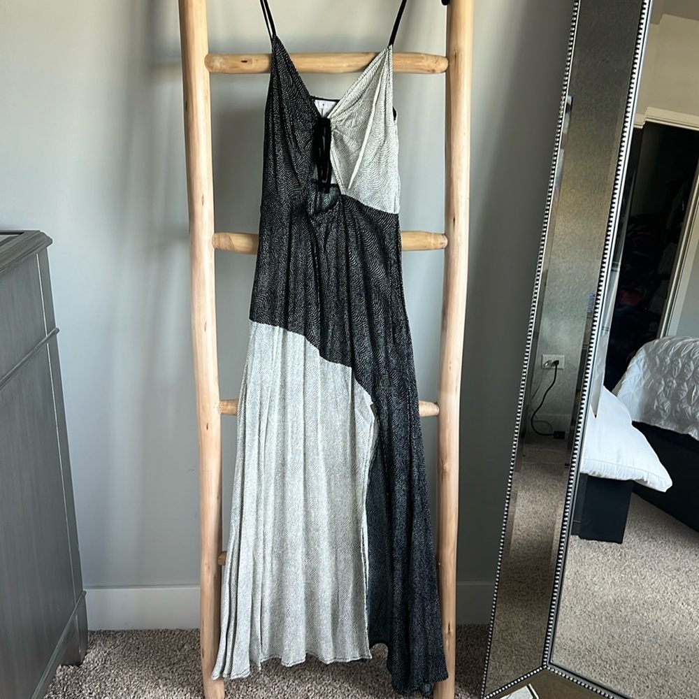 Straps dress with front slit.